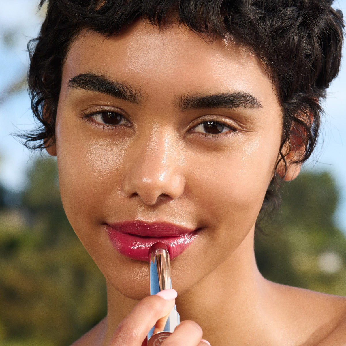 Clarins Lip Oil Balm hydration droplets on lips after application