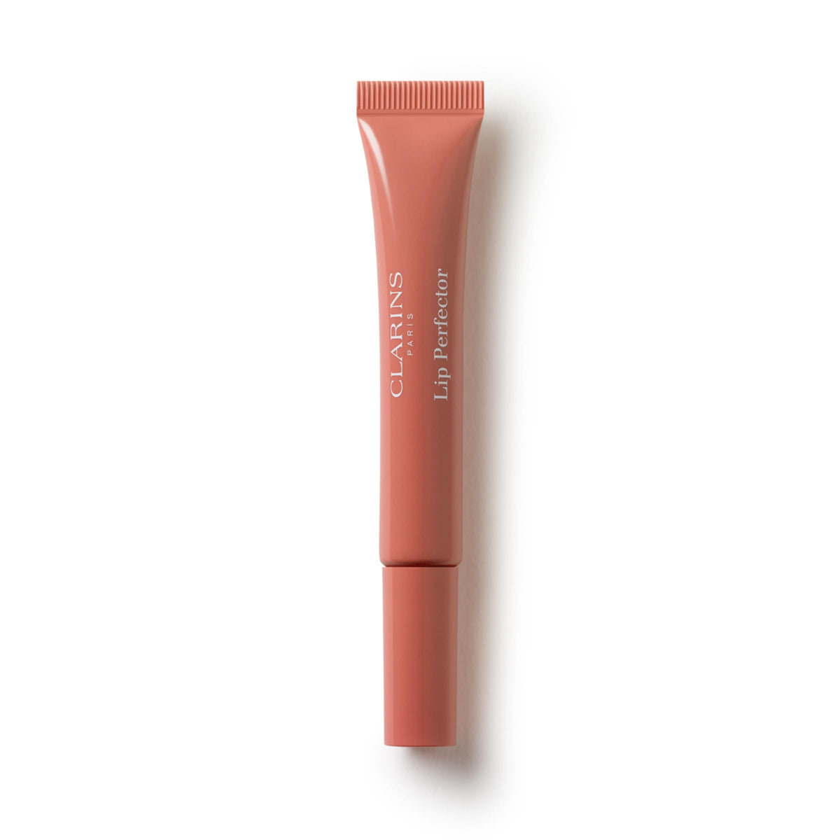 Clarins Natural Lip Perfector tube applied for smooth lips.
