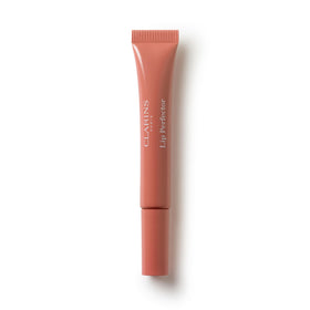 Clarins Natural Lip Perfector tube applied for smooth lips.