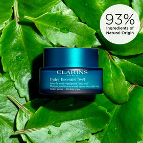 Clarins night cream on bedside tray in soft lighting