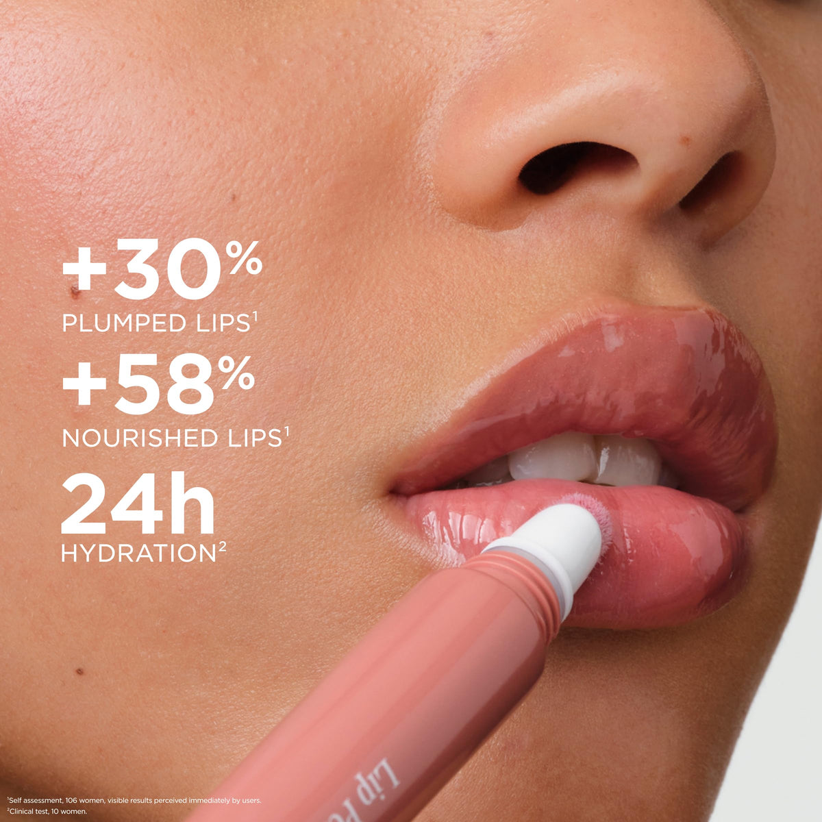 Clarins lip-plumping gloss in action for fuller look.