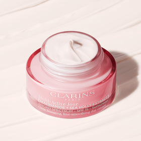 Clarins SPF 15 protection symbol visual suggesting daily sun defense for the face.