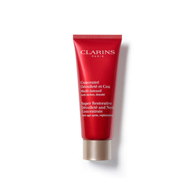 Clarins Super Restorative Decollete and Neck Concentrate bottle close-up, nourishing formula for firmer skin.