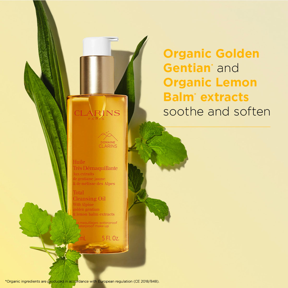 Applying Clarins Total Cleansing Oil to the face for gentle cleansing.