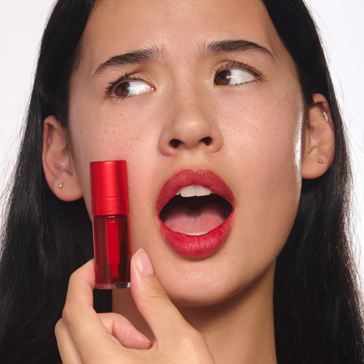 Clarins Water Lip Stain full-lip portrait highlights lasting matte color.