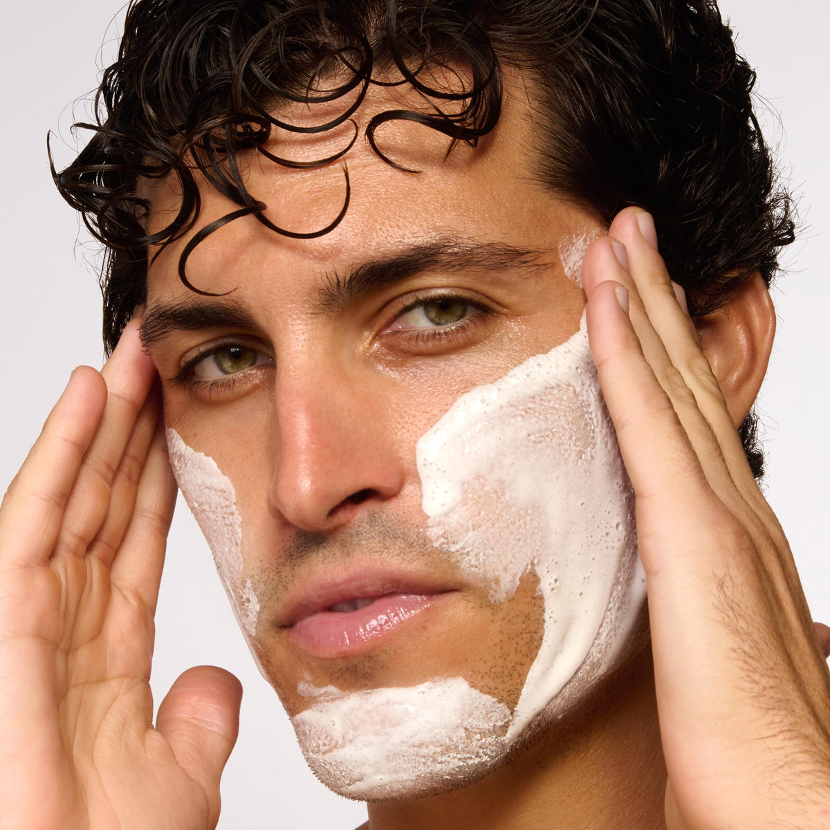 ClarinsMen Exfoliator Cleanser lava powder close-up shows gentle exfoliation.
