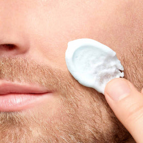 ClarinsMEN beard close-up showing hair softening before shaving.
