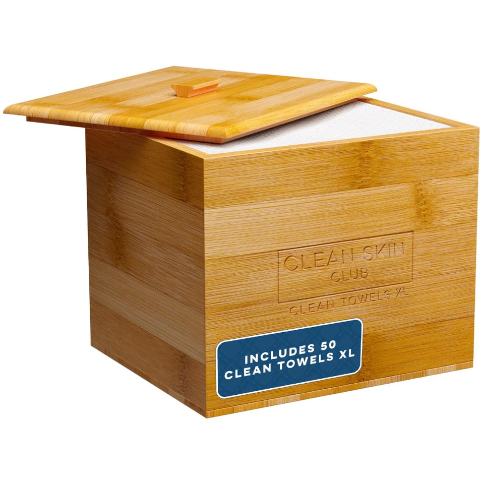Clean Skin Club Luxe Bamboo container with removable cover on a bathroom counter, keeps towels organized.