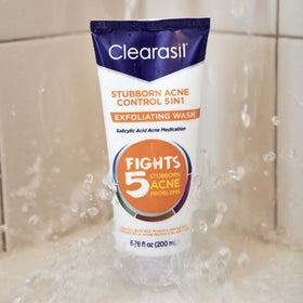 Dermatologist-tested logo badge on Clearasil Stubborn Acne Control packaging