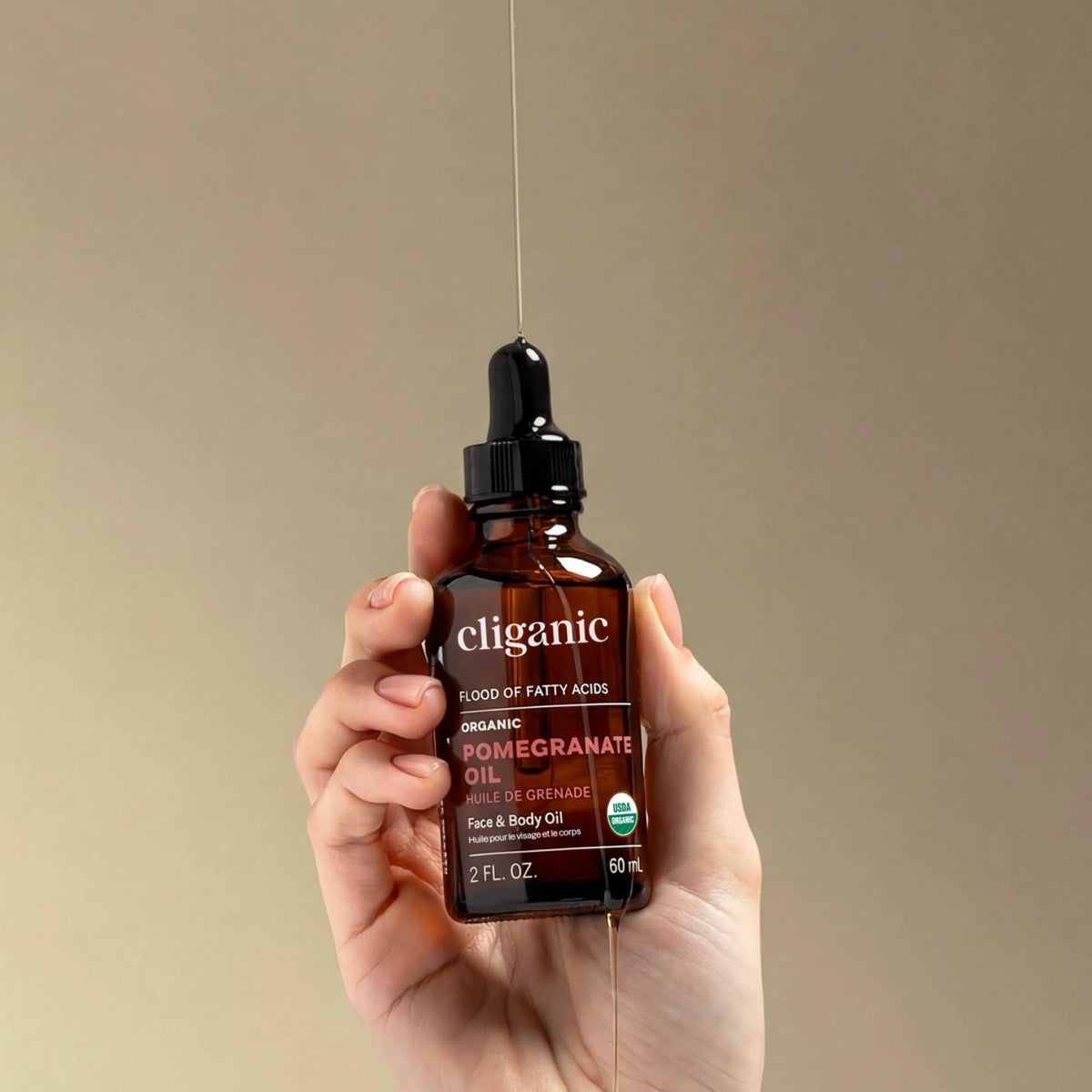 Cliganic Pomegranate Oil application on face highlights lightweight absorption