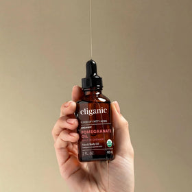 Cliganic Pomegranate Oil application on face highlights lightweight absorption