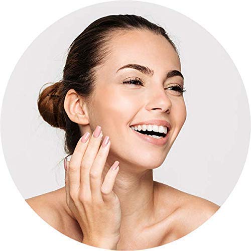 Cliganic Vitamin E oil applied to the face for nourished, radiant skin.