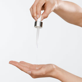 Clinique Acne Solutions serum texture swatch reveals smoothing, hydrating feel.