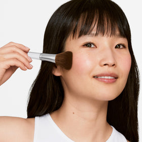 Clinique Blush Brush temples-nose-chin adds subtle, cohesive color across focal areas.
