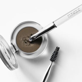 Clinique Brow Brush in use to shape and define natural brows.