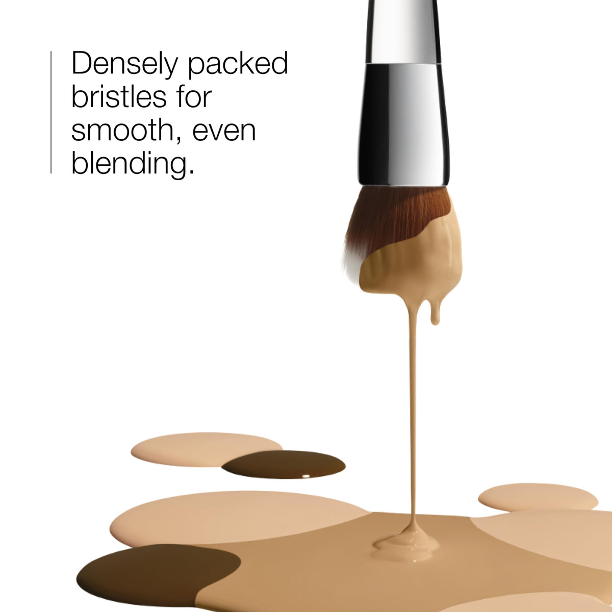 Clinique foundation brush in action buffing liquid foundation for even coverage.