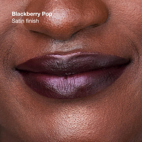 Close-up of Clinique Pop Longwear Lipstick being applied for even coverage