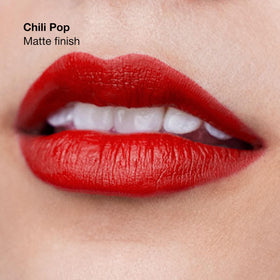 Clinique Pop Longwear Lipstick Chili Pop application shows smooth glide.
