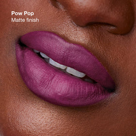 Clinique Pop Longwear Lipstick texture on lips demonstrates satin versus matte finish.