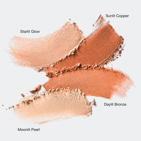Clinique True Highlight Starlit Glow swirl highlights cheekbones with celestial glow.