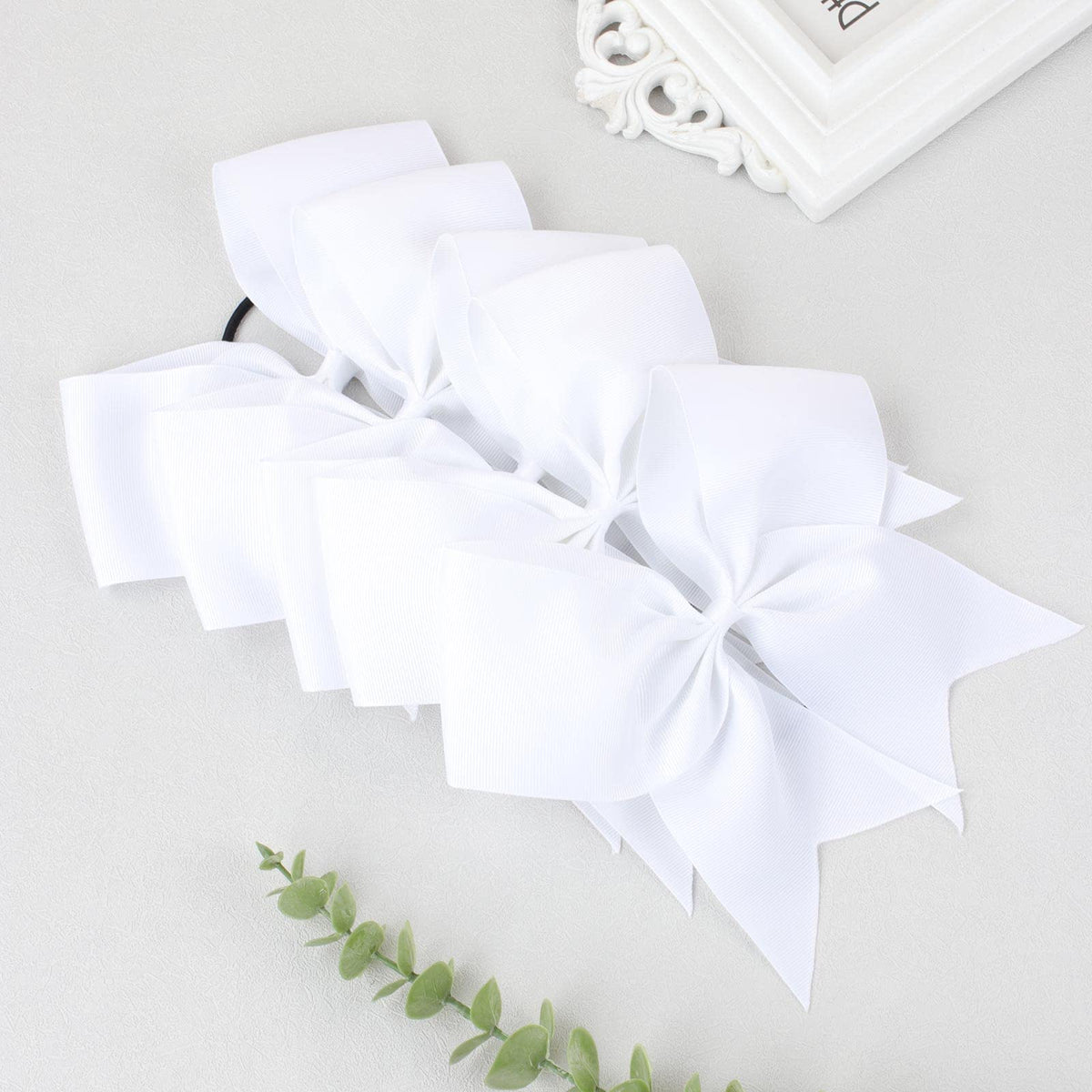 CN room decor with white cheer bows for events