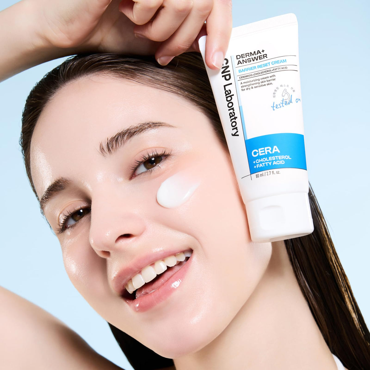 Applying CNP Barrier Reset Cream in morning routine for daily comfort.