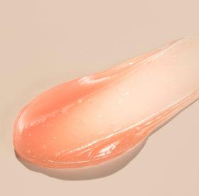 CNP Honey Lip Butter dial-applier close-up emphasizing hygienic control.