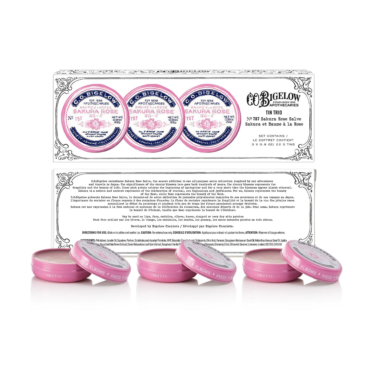 Close-up of Sakura Rose Salve tins highlighting compact packaging for travel.