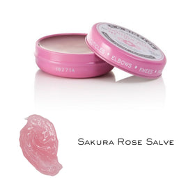 Multi-use Sakura Rose Salve applied to cuticles, hands, and rough skin areas.