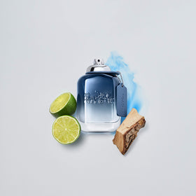 COACH Blue EDT bottle front label emphasizes brand and citrus-amber blend.