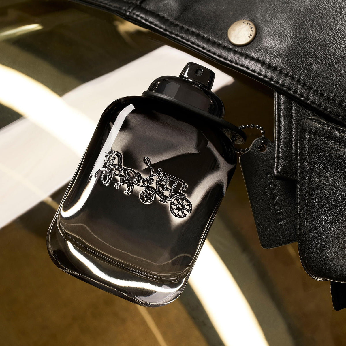 Close-up of the Coach For Men Jumbo EDT cap with premium detailing