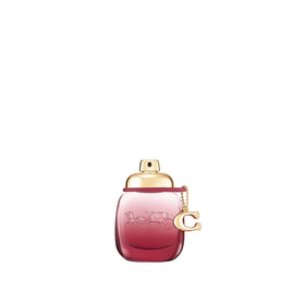 Coach Wild Rose bottle with ombre gradient suggesting bold, feminine allure for daily wear.