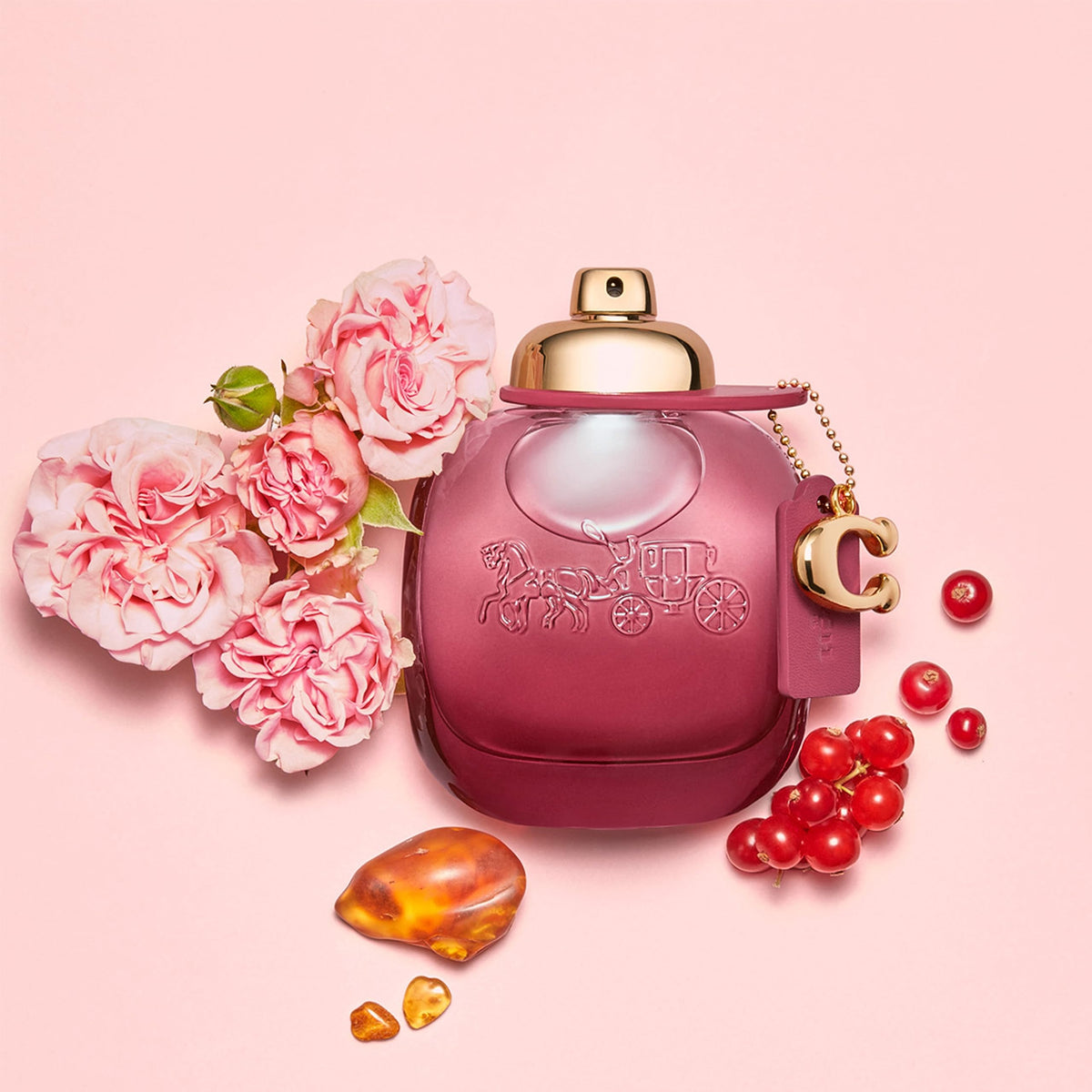 C charm detail adds signature style to Coach Wild Rose bottle.