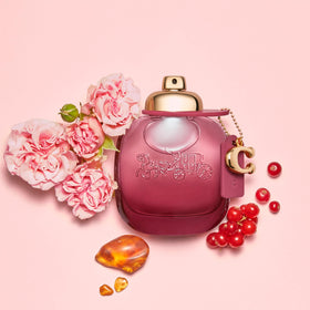 Coach Wild Rose bottle close-up of the C charm detail on the cap.