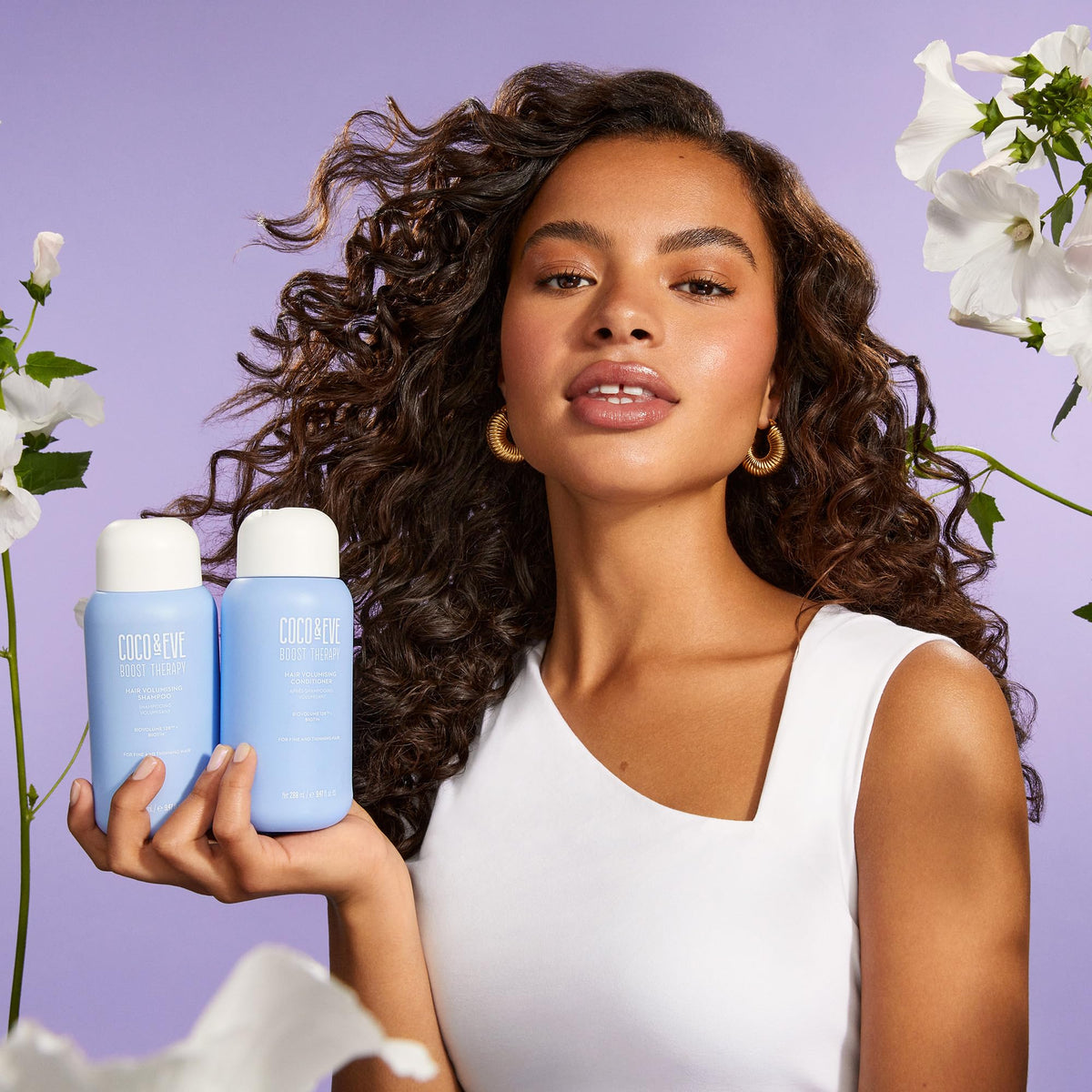 Coco & Eve Boost Therapy packaging display with vegan formula claim