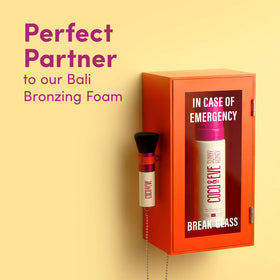 Coco & Eve Sunny Honey bronzing foam on hands and feet for even coverage.