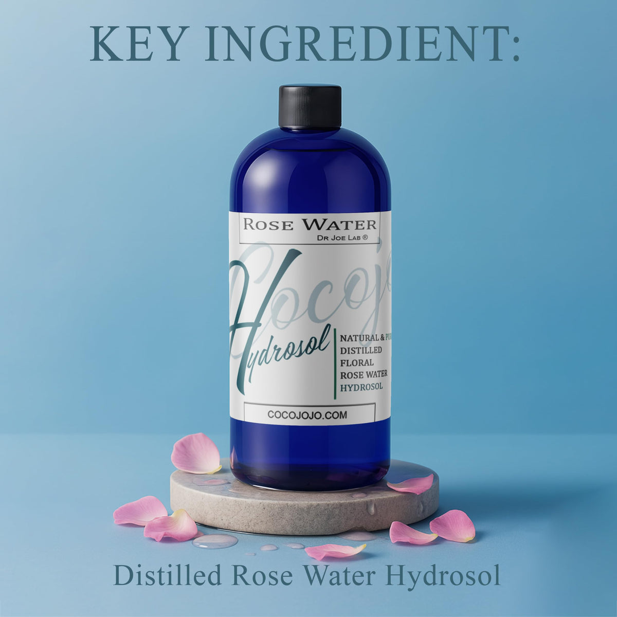 Close-up of rose petals beside Cocojojo hydrosol suggesting natural fragrance and purity.