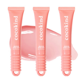 Cocokind Ceramide Lip Blur Balm Be Kind coral pink tube gliding on lips for hydration