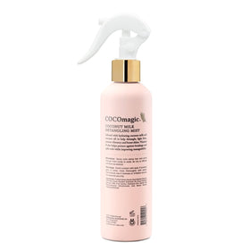 Cocomagic detangling mist dispense pump demonstrates easy, non-greasy application