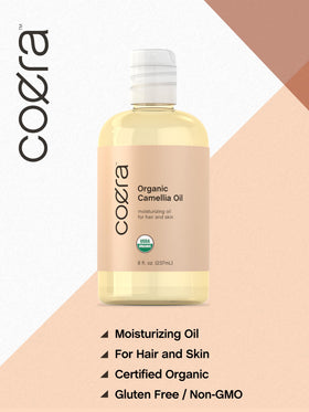 Coera Camellia Seed Oil applied to a hair strand for smooth shine.
