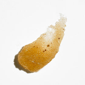 Colleen Rothschild Sugar Lip Scrub being massaged onto lips for exfoliation.
