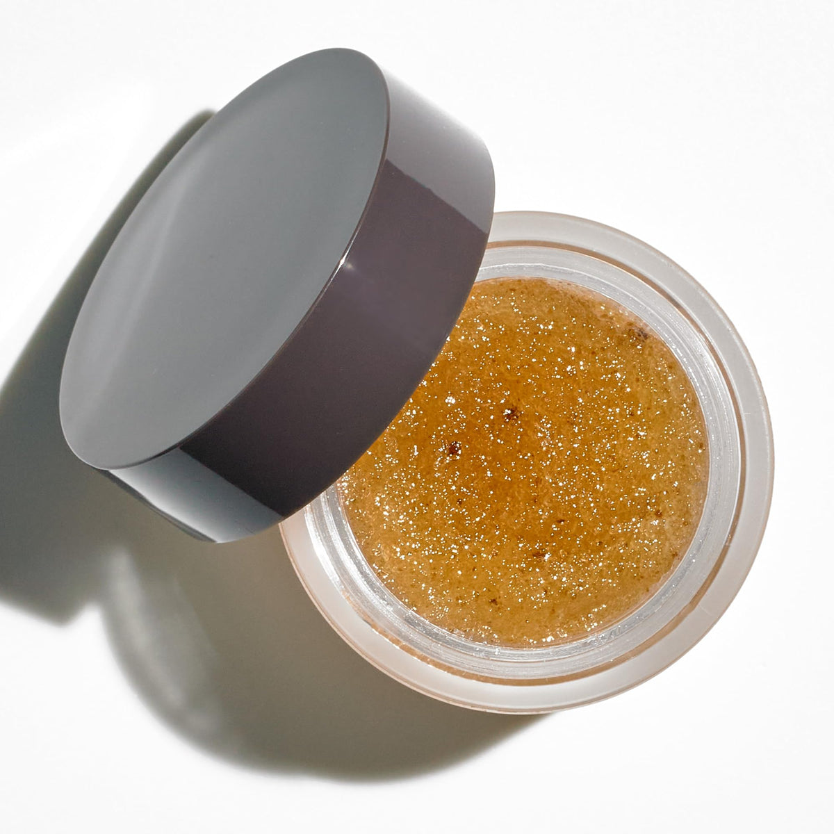 Colleen Rothschild Sugar Lip Scrub close-up of shea butter and jojoba oil ingredients.