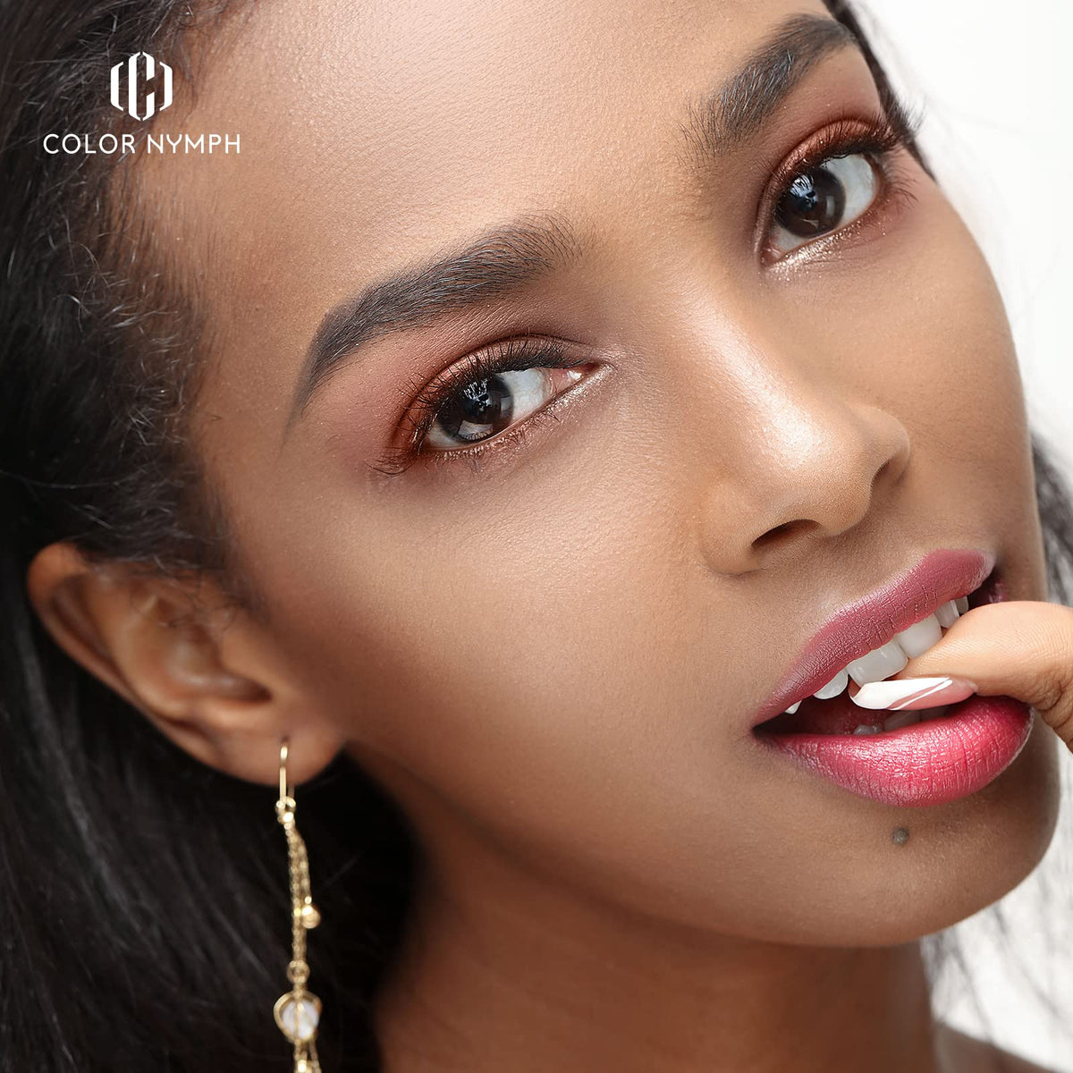 Color Nymph brown eyeliner pencil provides precise definition.