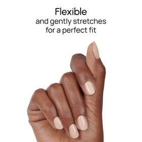 Hand with Toffee Nut nails for a polished nude look.