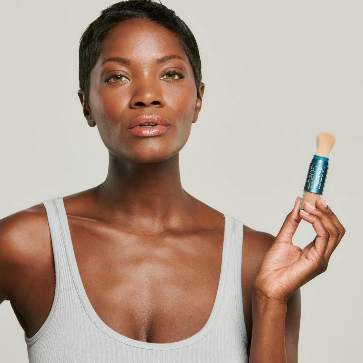 Colorescience sunscreen brush packaging highlighting travel-friendly SPF