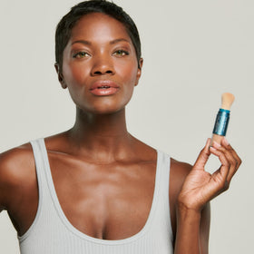 Colorescience sunscreen brush packaging highlighting travel-friendly SPF
