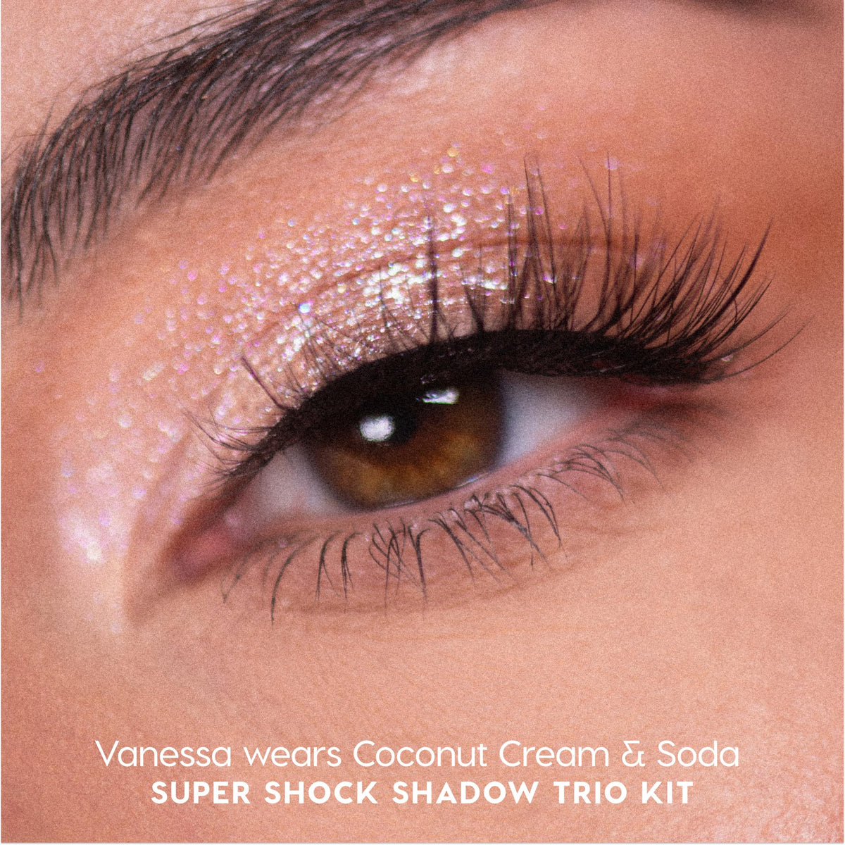 ColourPop Coconut Cream & Soda Extra Ice swatch reveals opal shimmer for bright, luminous lids.
