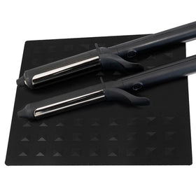 Colortrak heat-resistant styling station mat shown protecting a workstation from hot tools