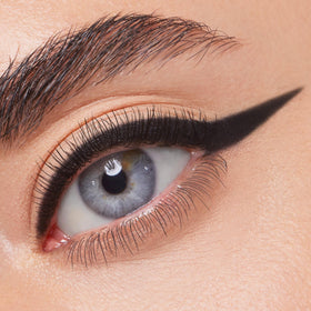 ColourPop Neutral Needs BFF Swerve eyeliner pencil creates precise onyx black line.