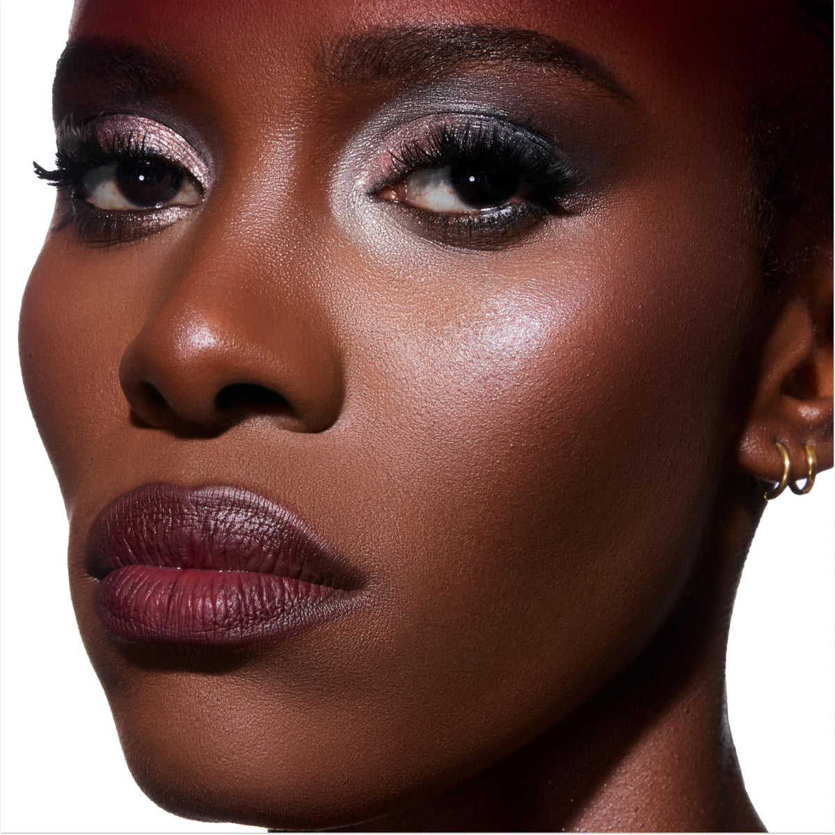 Side-by-side application of ColourPop Twilight Eclipse highlighter with finger for full coverage